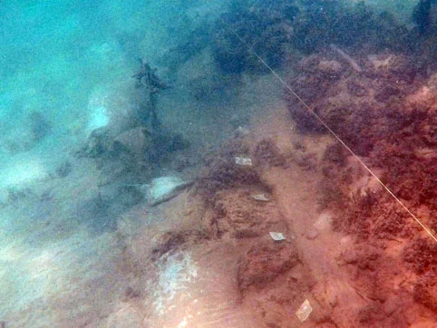 Sand bags from the 2000 survey and the exposed section of the ceiling planking level with the forward mast step