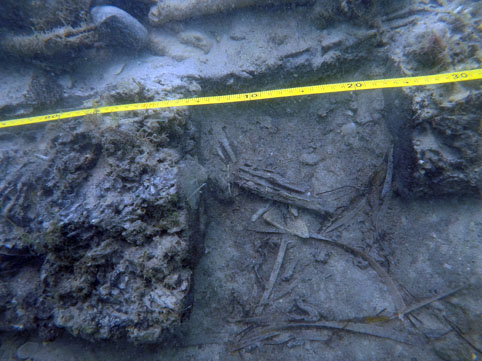 A round blue flint on top of the ceiling planking which was used for the flintlock