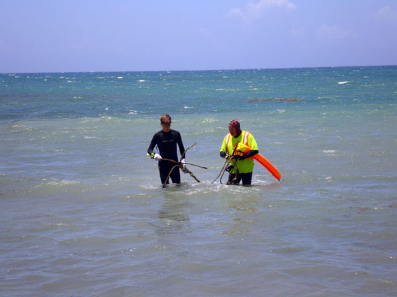 Raimund and Connor recover the anchor which was tangled arround the barrel hoops so that it can be returned to a fisherman