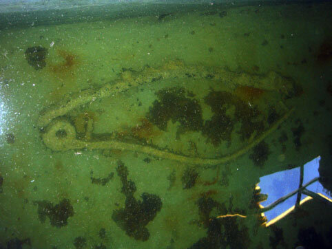 A matching gudgeon as one of the arms had been broken off the centre spindle by the force of the beaching during the wrecking process.