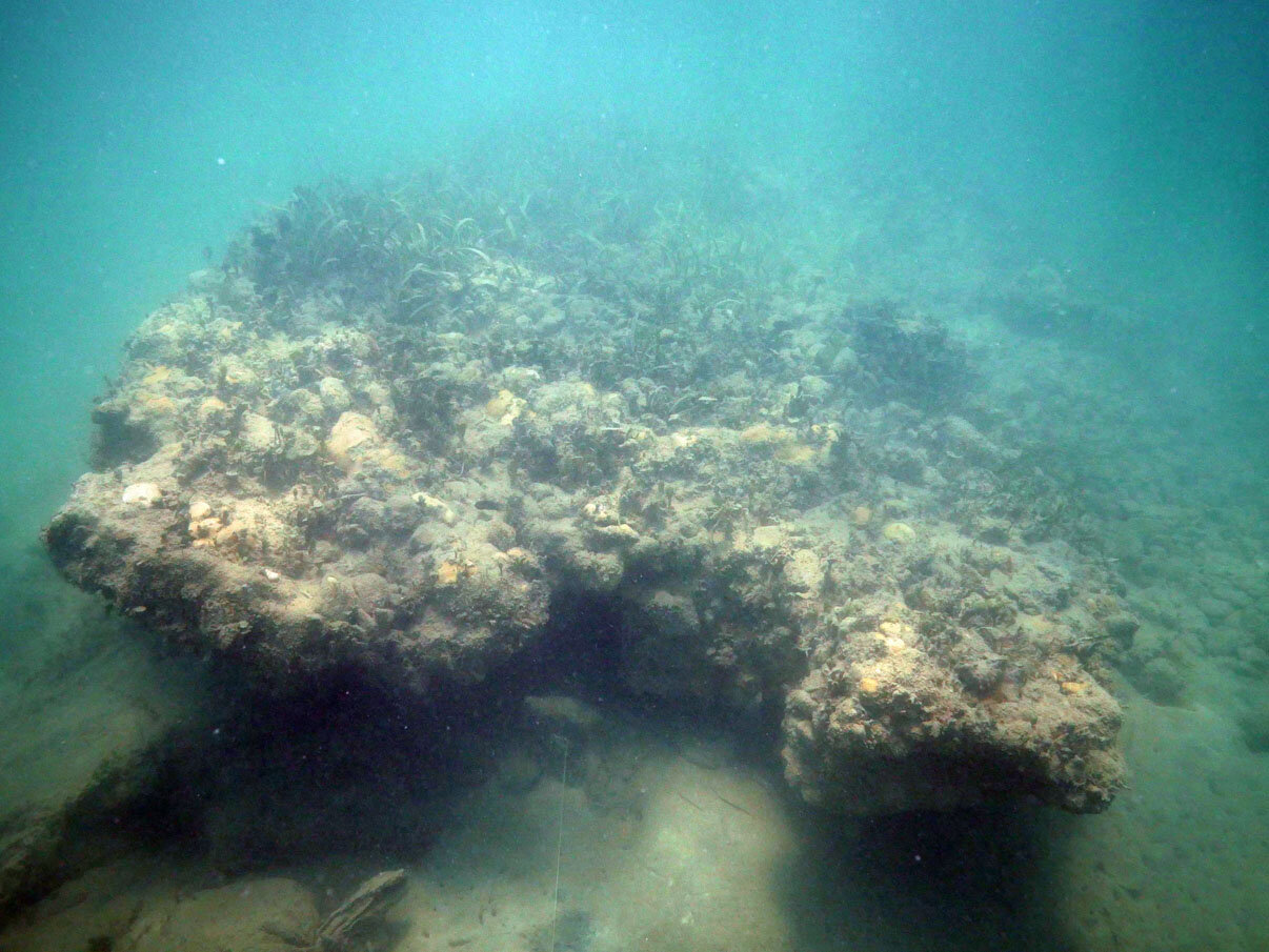 The list to the starboard side can be clearly seen, as can the ballast stones which have been washed by the storms from the port side to the starboard side.