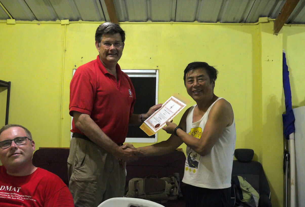 Presentation time Bob Yee receives his well-earned certificates.