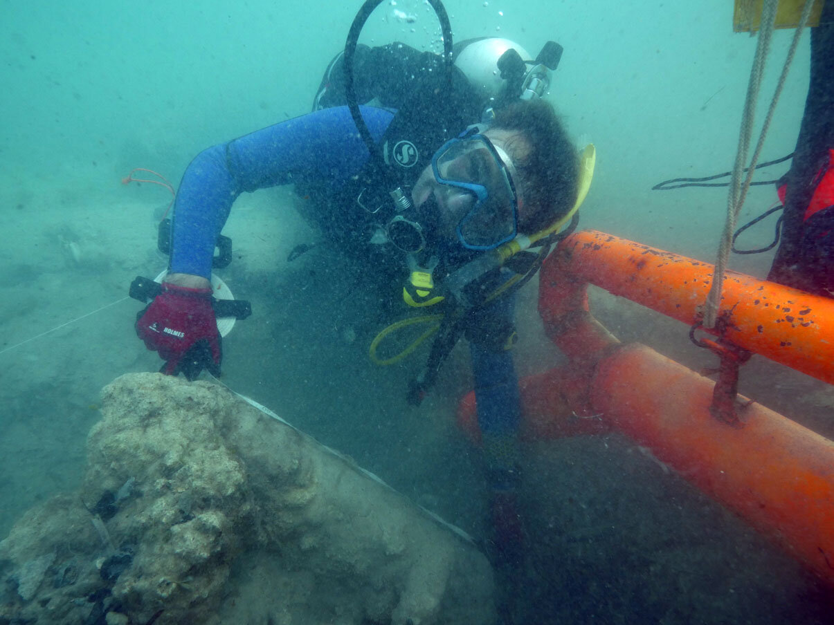 Steve Abell working on carefully uncovering the gradiometer hit which turns out to be a large concretion of iron ballast bars.