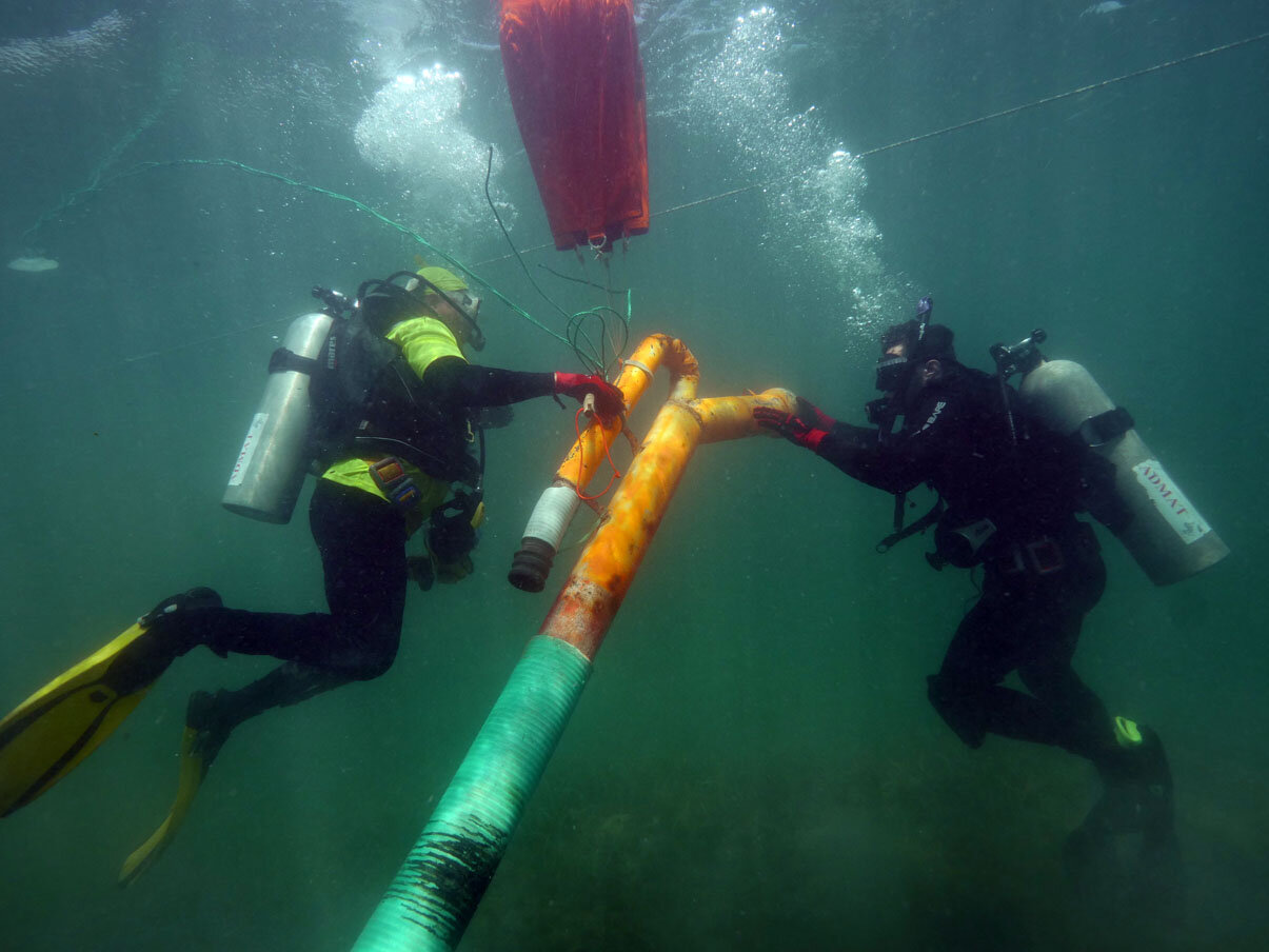 The archaeological dredge being relocated.