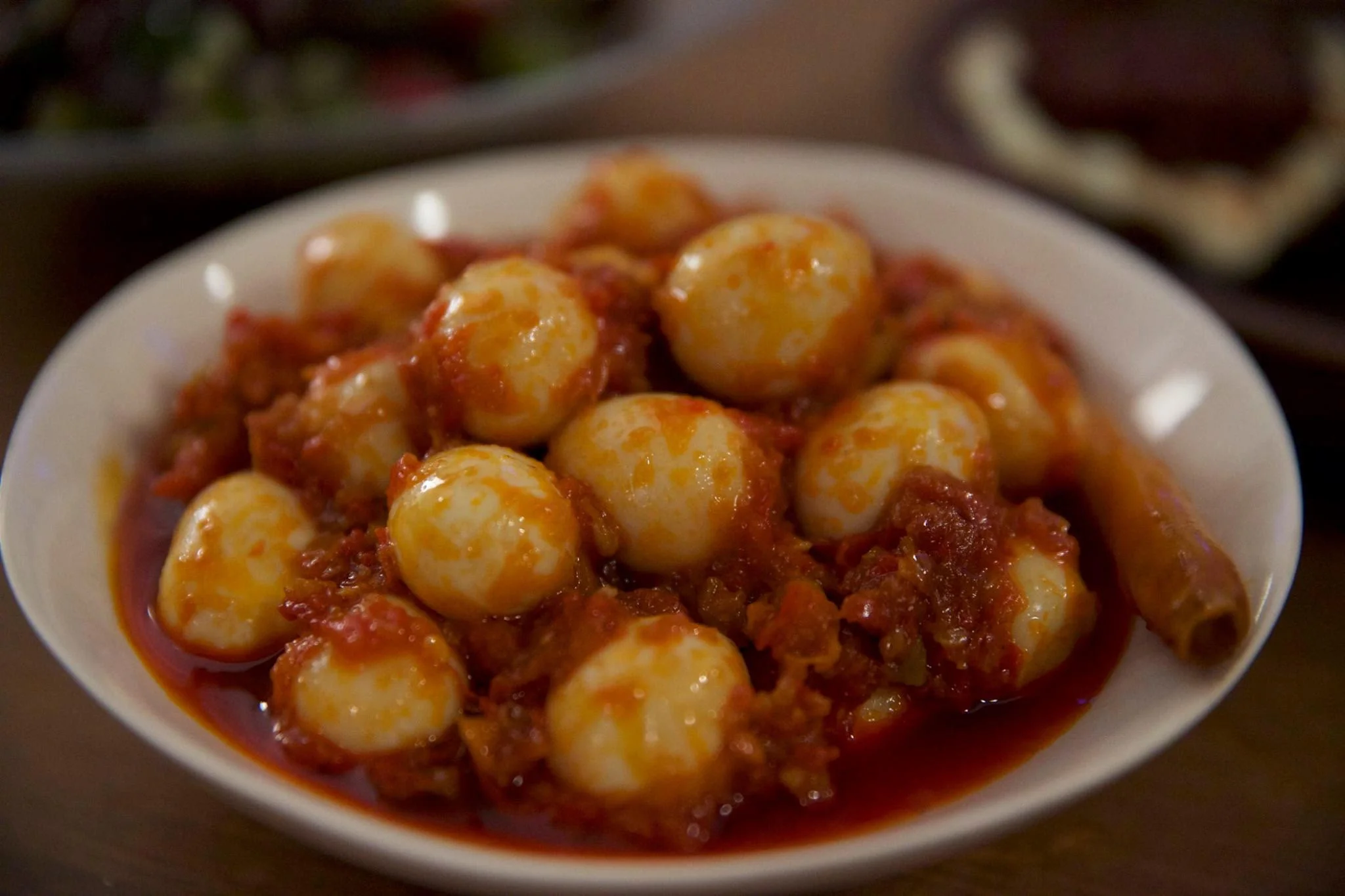 Quail eggs cooked in chili coconut sambal - a take on the traditional Javanese dish by Miranti. Photo by Baju Wijono