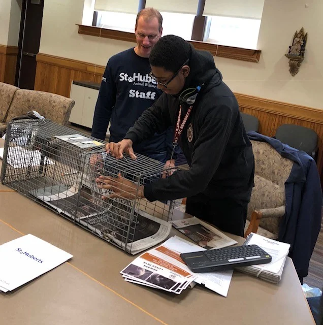 High school students gets hands on experience while learning about Trap Neuter Return.