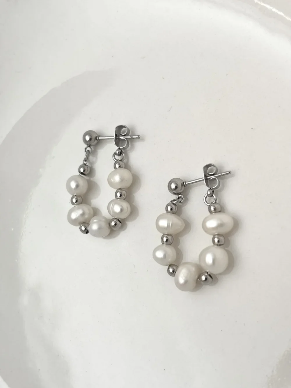 Boucles d’oreilles perles acier inoxydable — bijou surprise dans la chandelle