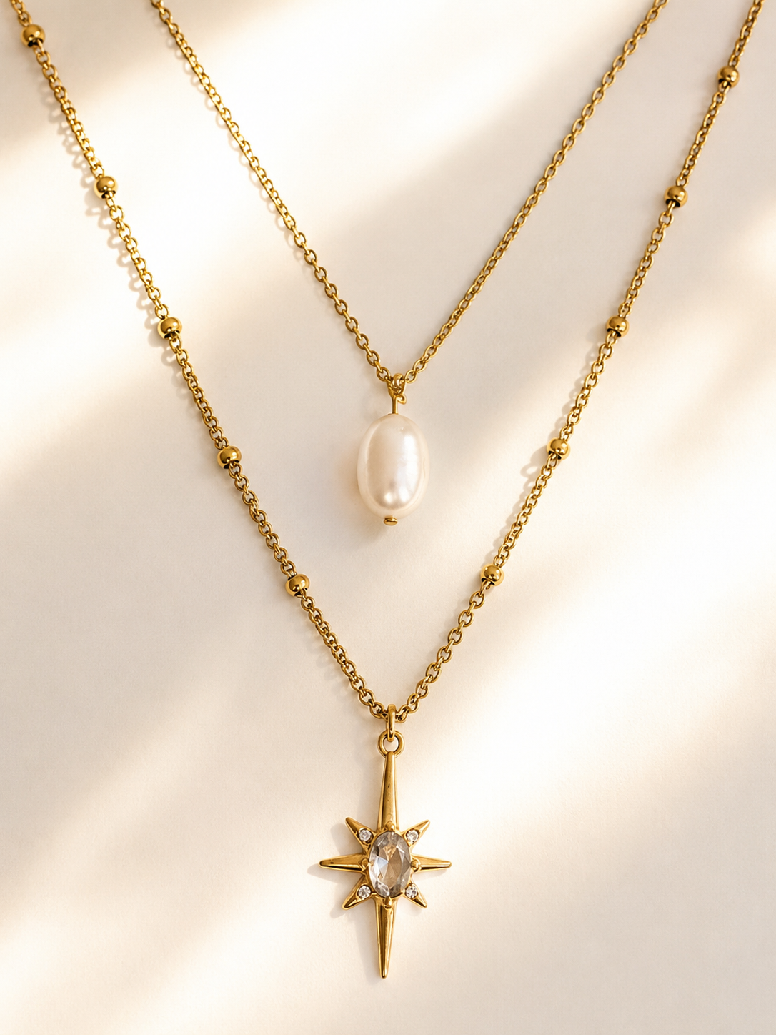 Collier double rang doré en acier inoxydable avec perle d’eau douce et pendentif étoile serti d’un zircon - Tokade