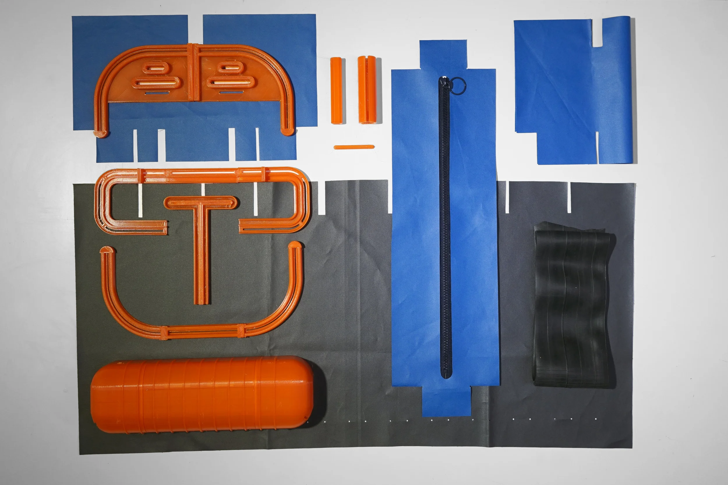 The waterproof fabric has high resistance and is good for cutting without finishing edges. The waterproof zipper is attached by thermo-sensitive adhesive that makes the assembling process stitch free. Rubber has good abrasion resistance and can absorb shocks, which makes it a competent material for the stripe.