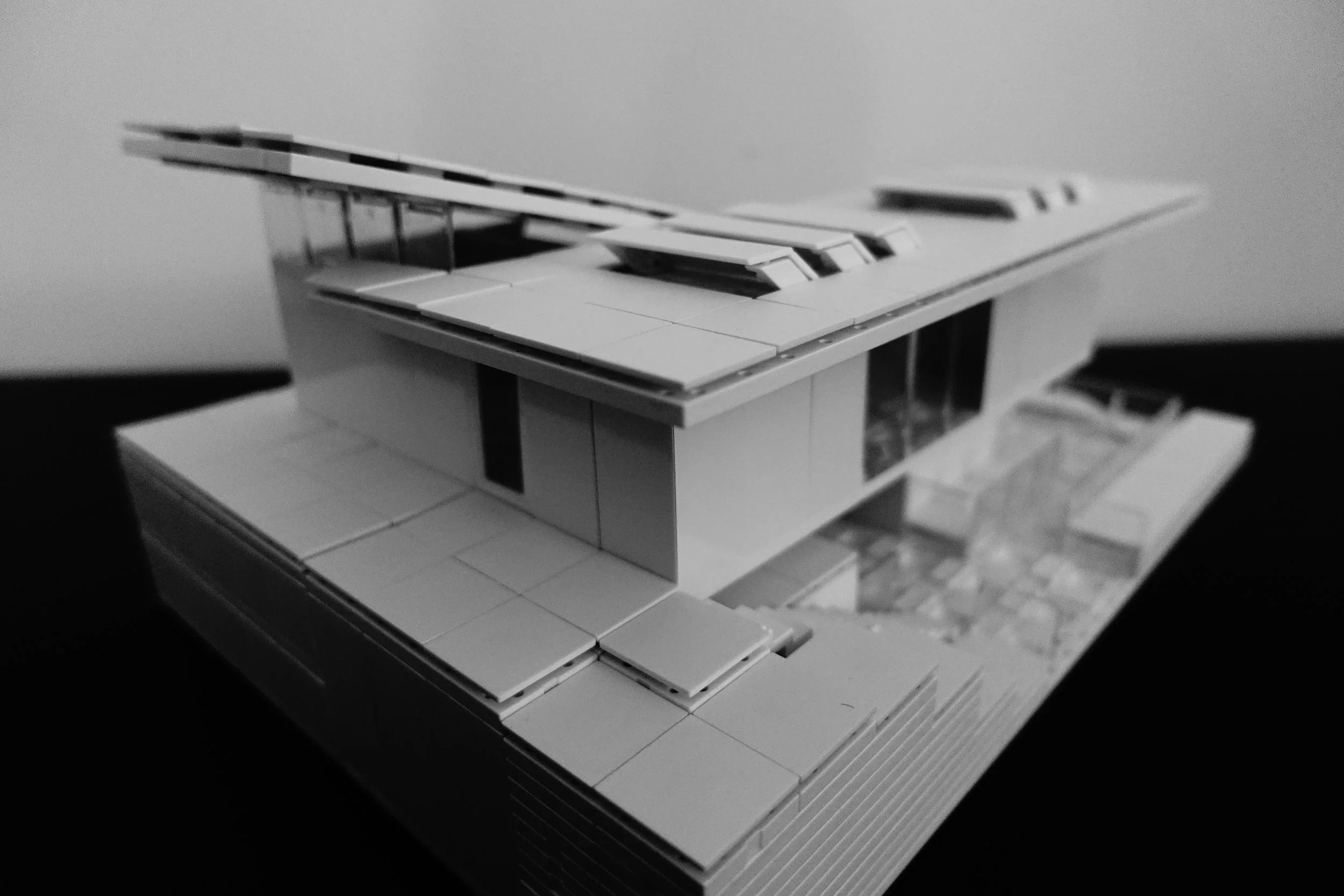 Front facade and view lower patio space.