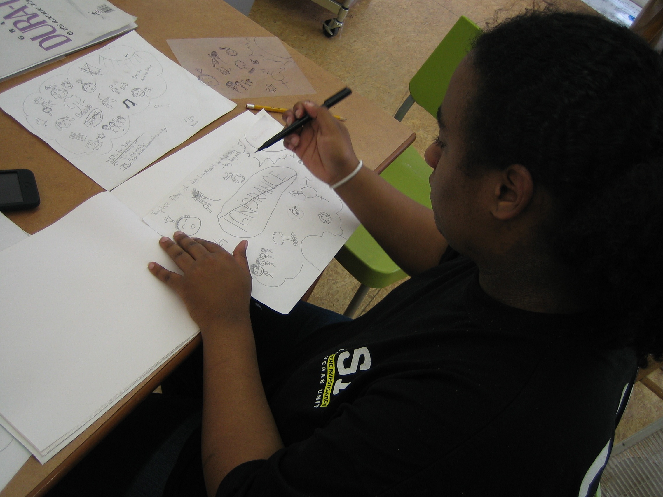 Sadie works on sketches for her final portrait. 