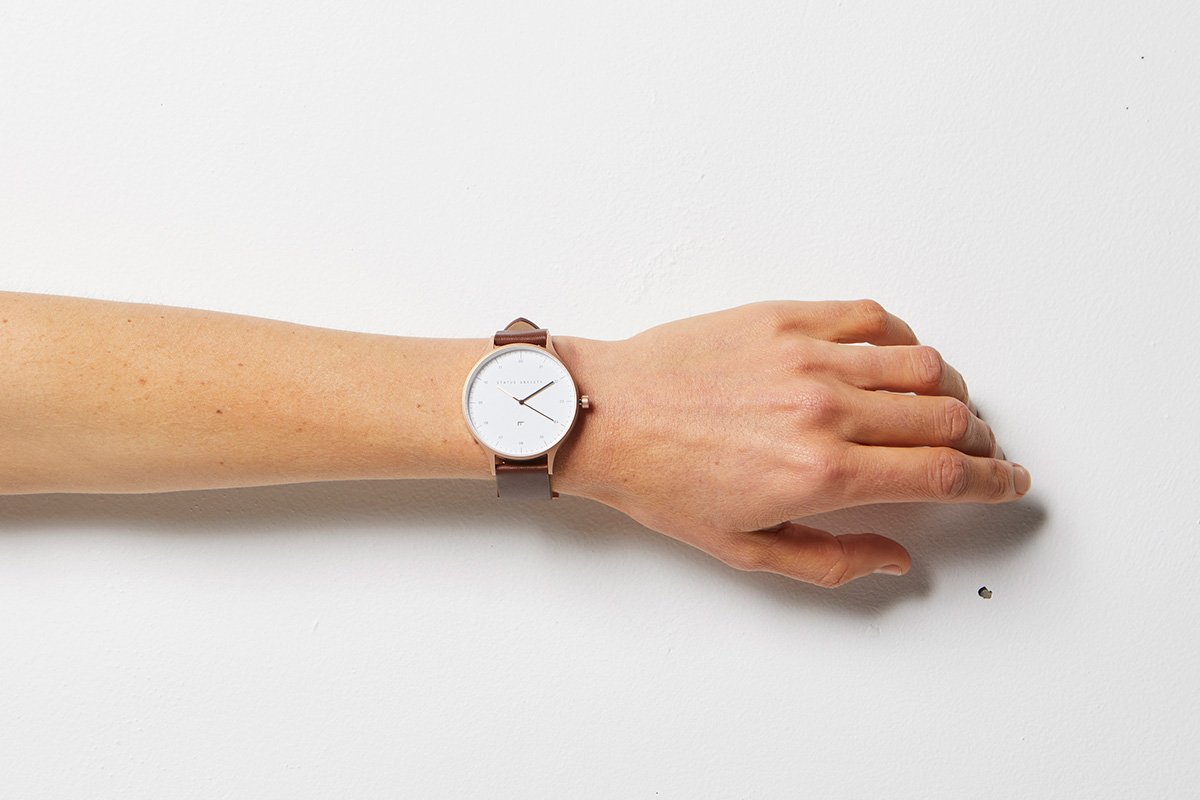 statusanxietycampaign-watch-inertia-brushed-copper-white-face-brown-strap-studio2-lifestyle-img.jpg