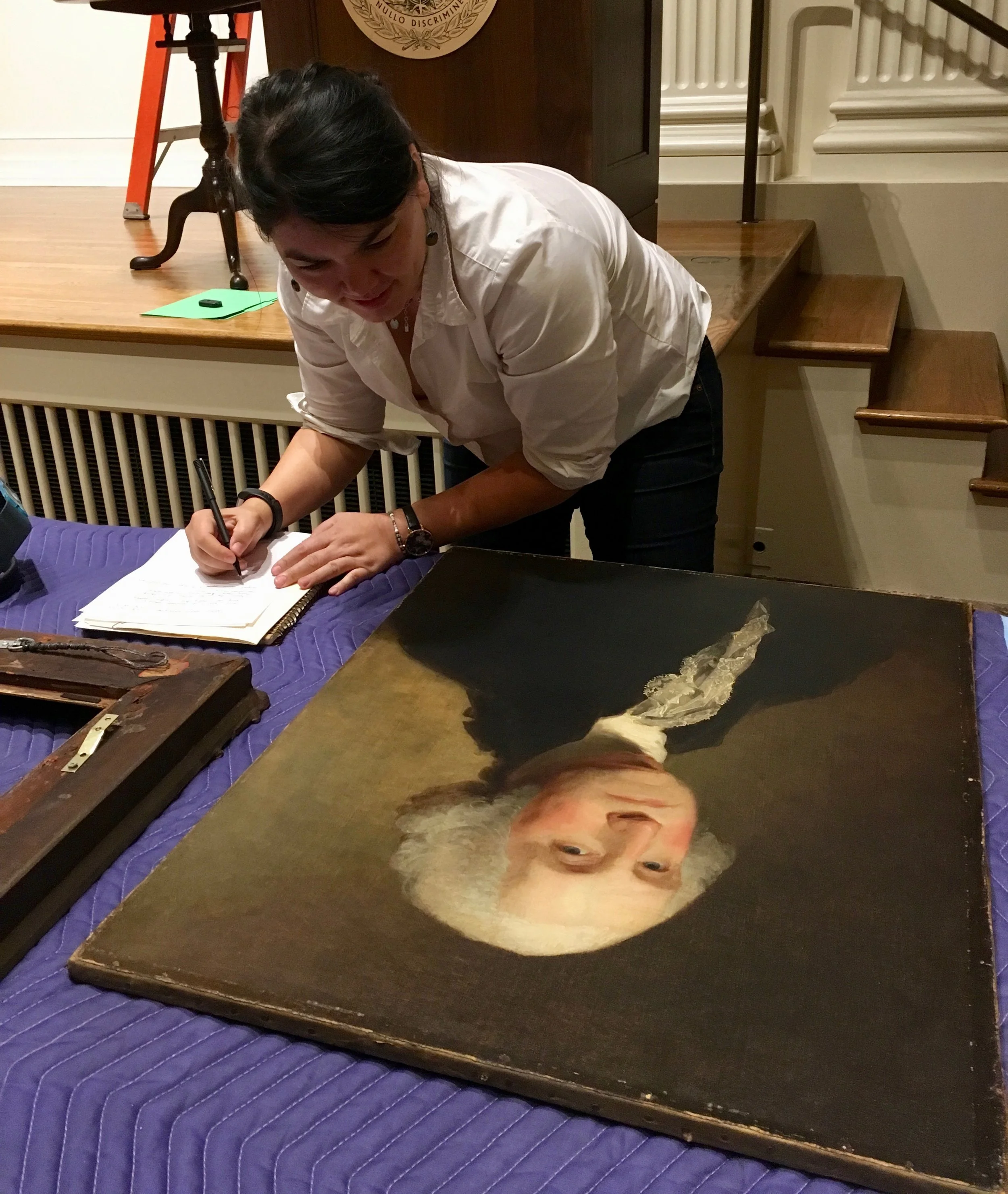 Examining the American Philosophical Society's portrait of George Washington by Gilbert Stuart.