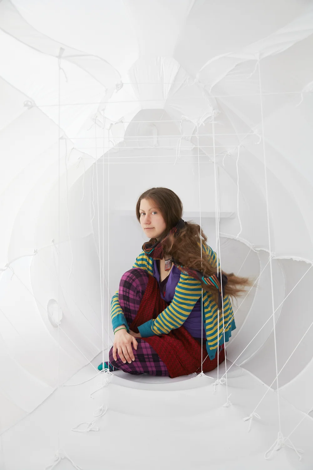 Nicole in her sculpture Vessel. Created in Russia as part of a residency with the National Contemporary Center for the Arts. This photo was taken in Berlin by Michael Wickham as a part of his 40 Berliners Series.
