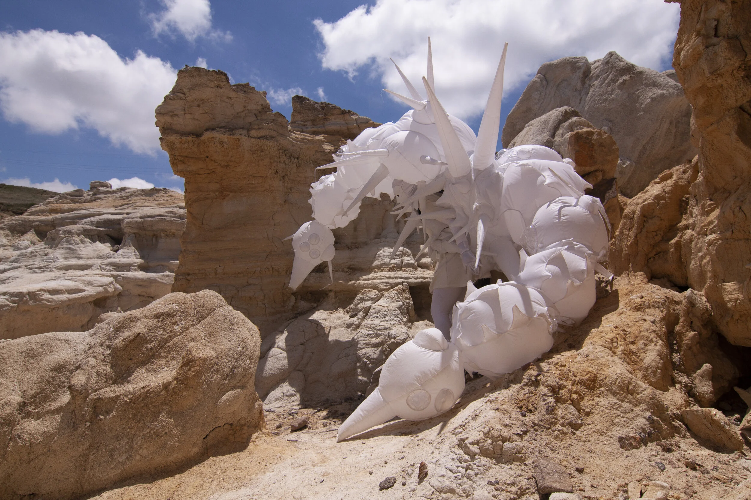 Inflatable fabric sculpture creature performance in Paint Mines