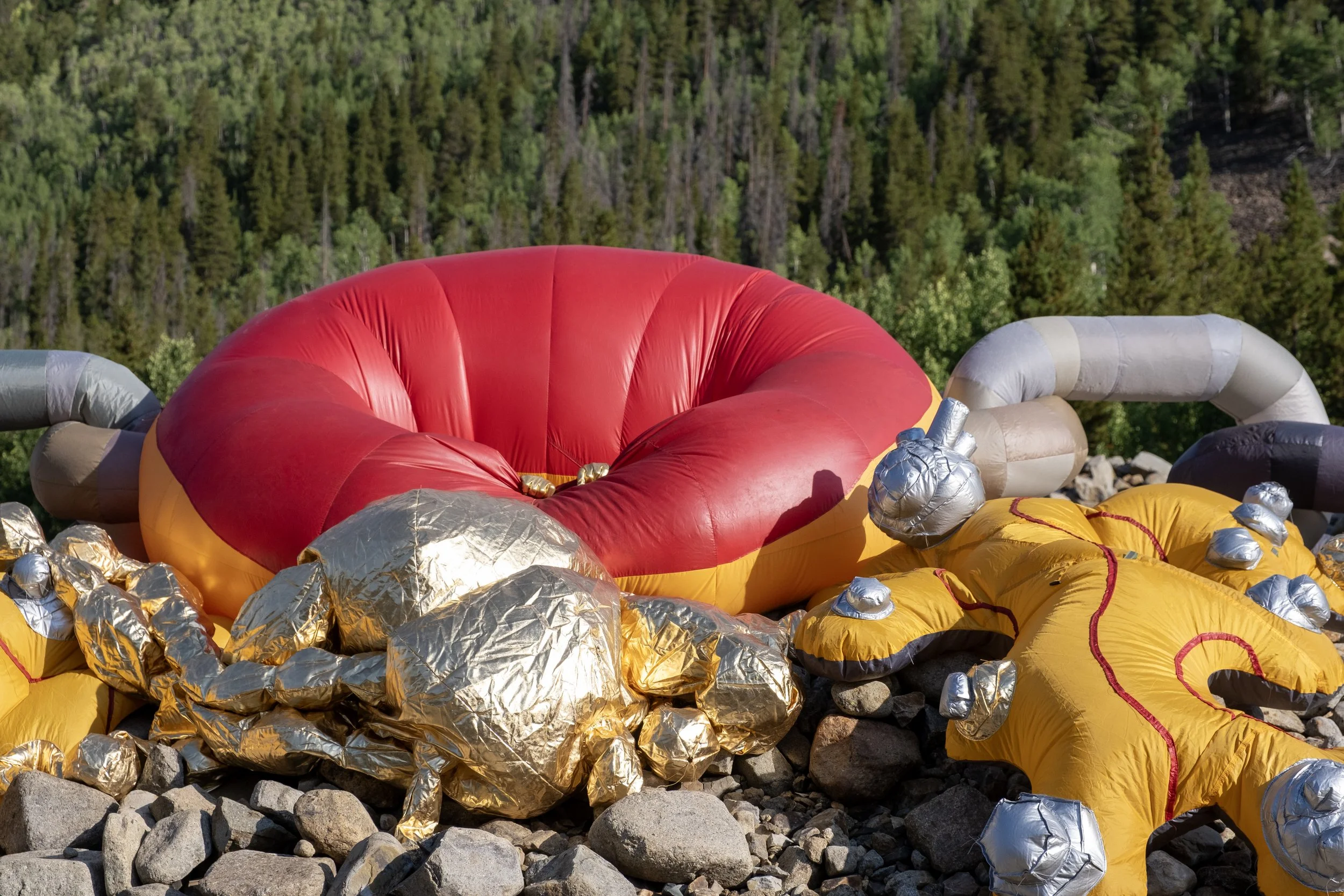The dredge inflatable sculpture performance in tailings piles in Breckenridge