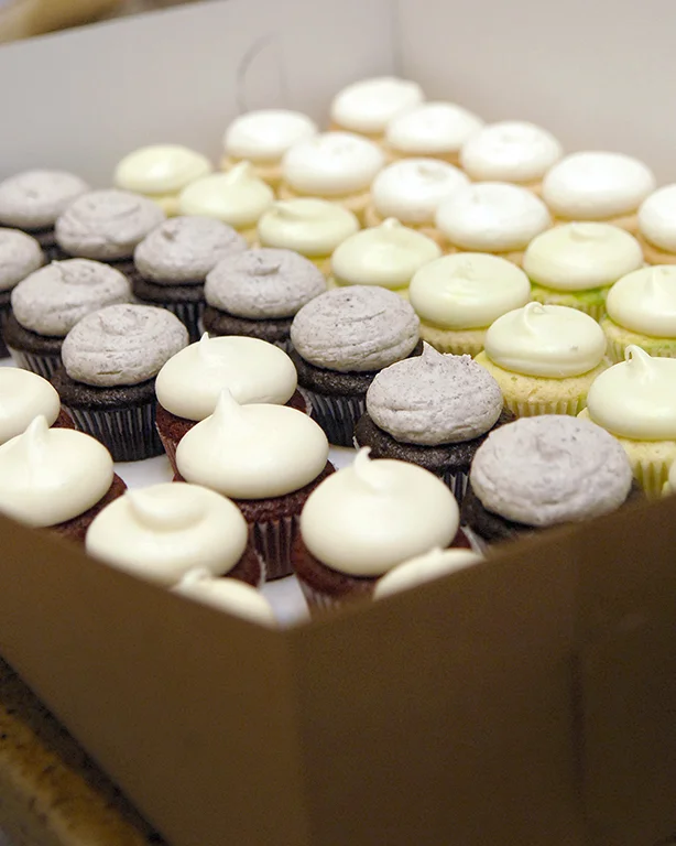 Mini Cupcakes 2.25 each (Minimum of 12 of a flavor) Order our Mini Cupcakes in advance! They are available in several flavors: All American Chocolate Old Fashioned Chocolate Classic Vanilla "Oreo" Buttercream Pumpkin Chocolate Chip Chocolate with vanilla buttercream Red Velvet Mocha Buttercream 18 Carrot Pink Lemonade 7 Up (Seasonal)