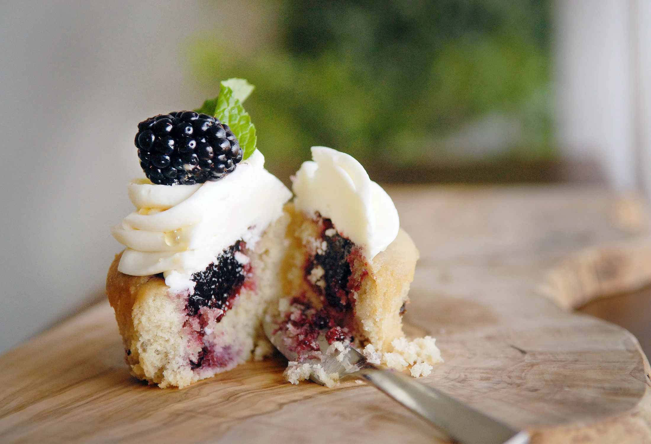 Malted Honey & Blackberry Artisan Cupcake 4.25 each Fresh, organic blackberry cupcakes filled with Jammin' George’s blackberry jam, iced with a malted honey buttercream and garnished with a sprig of our bakery-grown mint, a drizzle of local honey and a fresh organic berry. Our malt is from Hoosier Hill Farm in Indiana. (Available during the months of August and September)