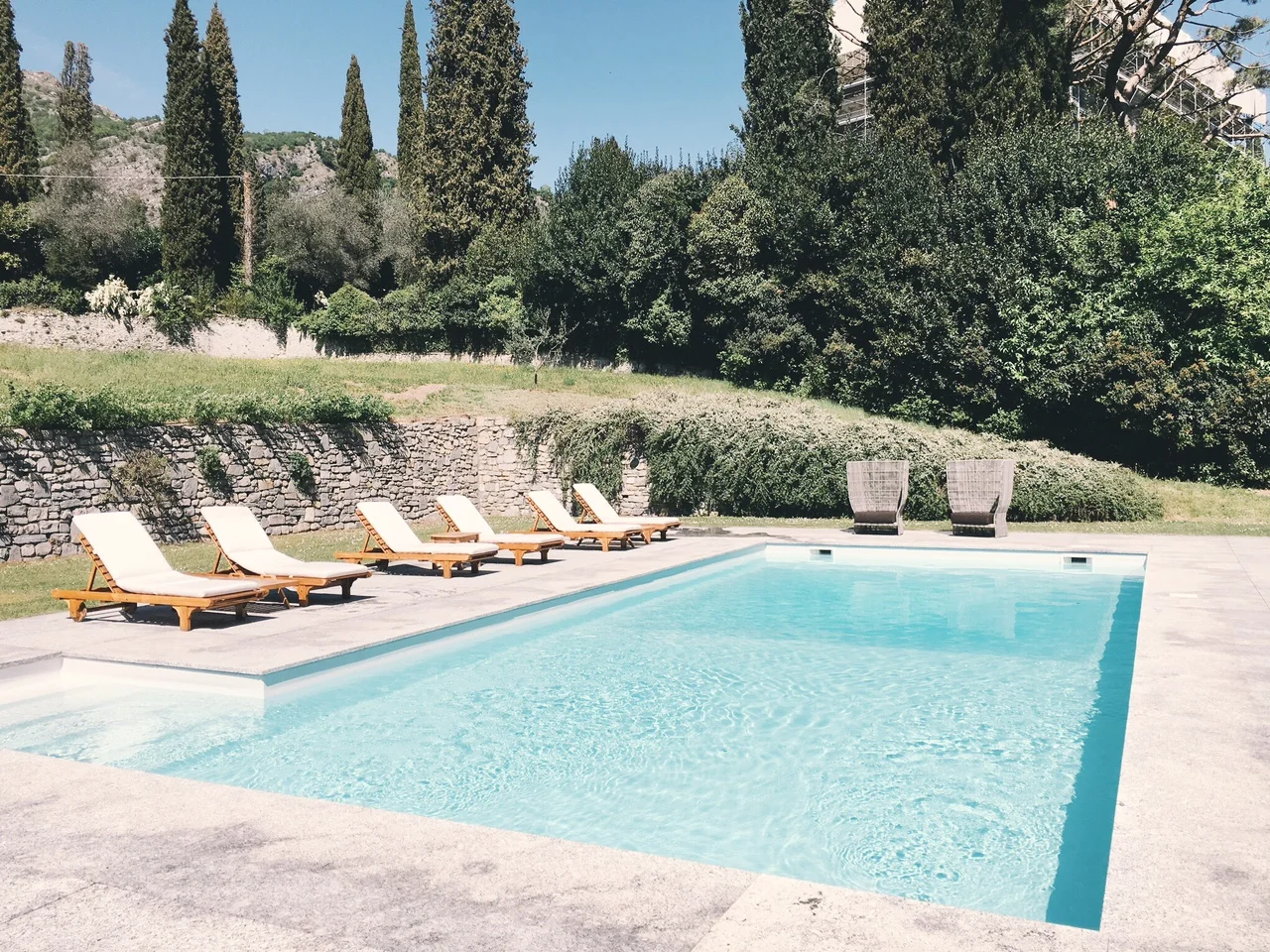 Pool with lounge chairs at Villa Sola Cabiati