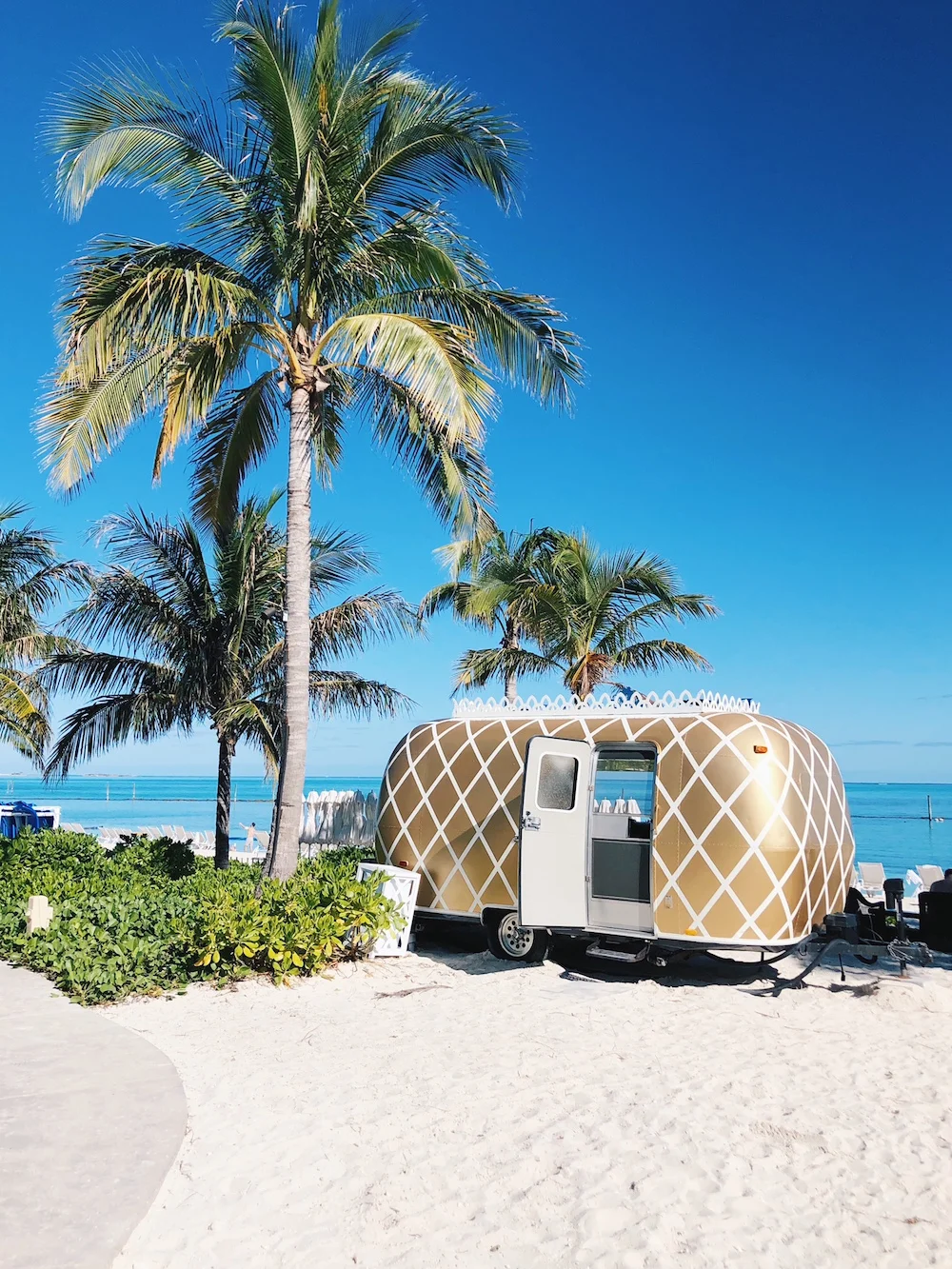 Gold white airstream pineapple print food truck on beach Grand Hyatt Baha Mar Bahamas