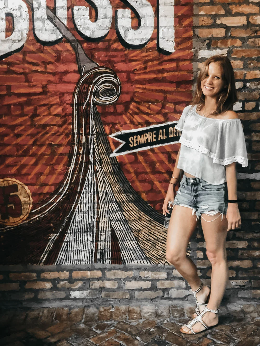 Girl in shorts next to Ft. Lauderdale wall mural