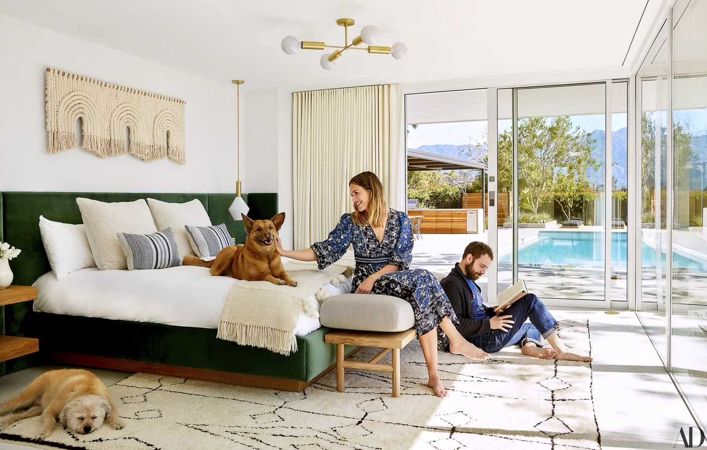 Mandy Moore & her now husband Taylor Goldsmith’s master bedroom is a dream! We love her custom-built bed by Sarah Sherman Samuel in a Fabricut velvet with macramé artwork by Sally England above. The cozy bench by Katy Skelton & Cedar & Moss lighting just add to the beauty of the sanctuary.