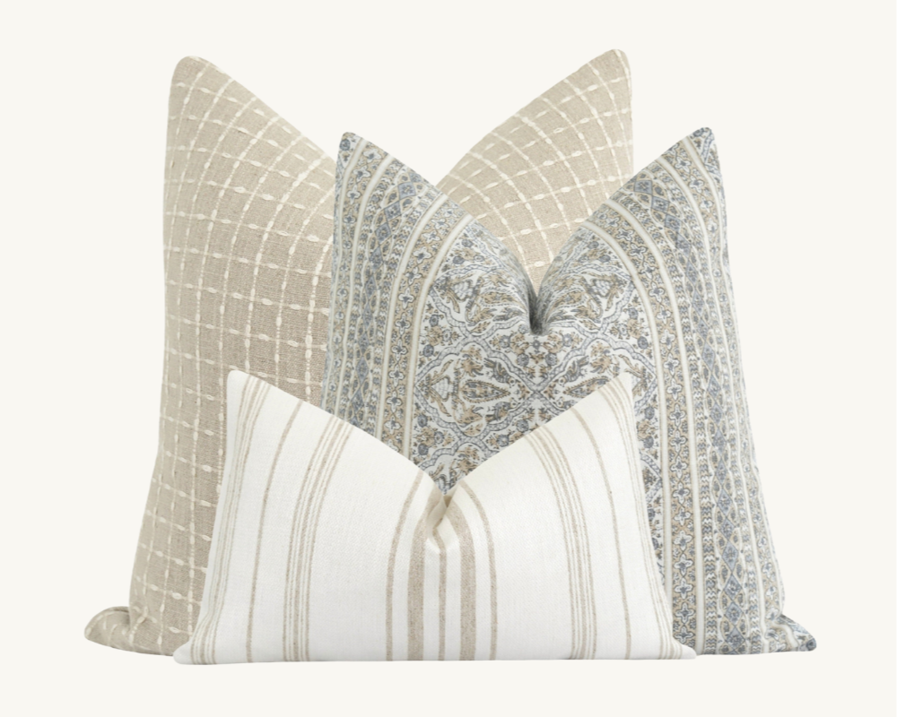 land of pillows blue and tan curated pillow combo coastal living room design moodboard