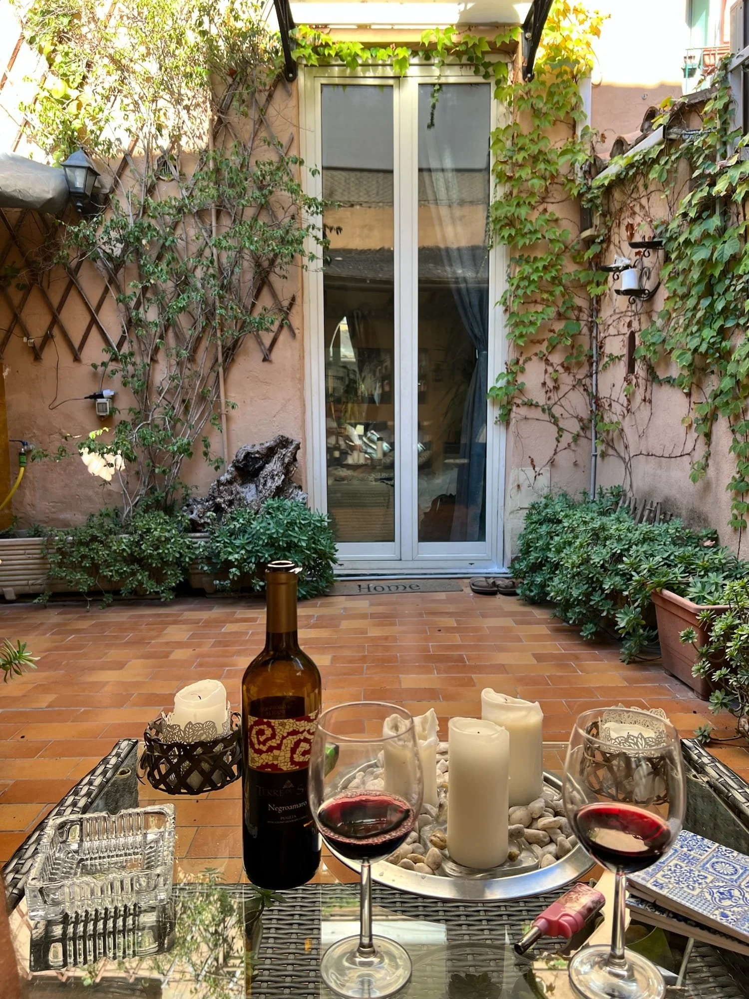 wine on the terrace at the best airbnb in rome italy