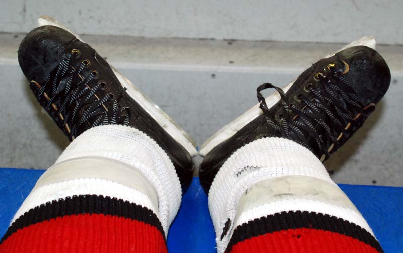 Resting on the bench while the ice is being resurfaced, my feet are positioned in the “V-diamond” formation (heals together with knees bent), which is the foundation of effective skating, I learned.