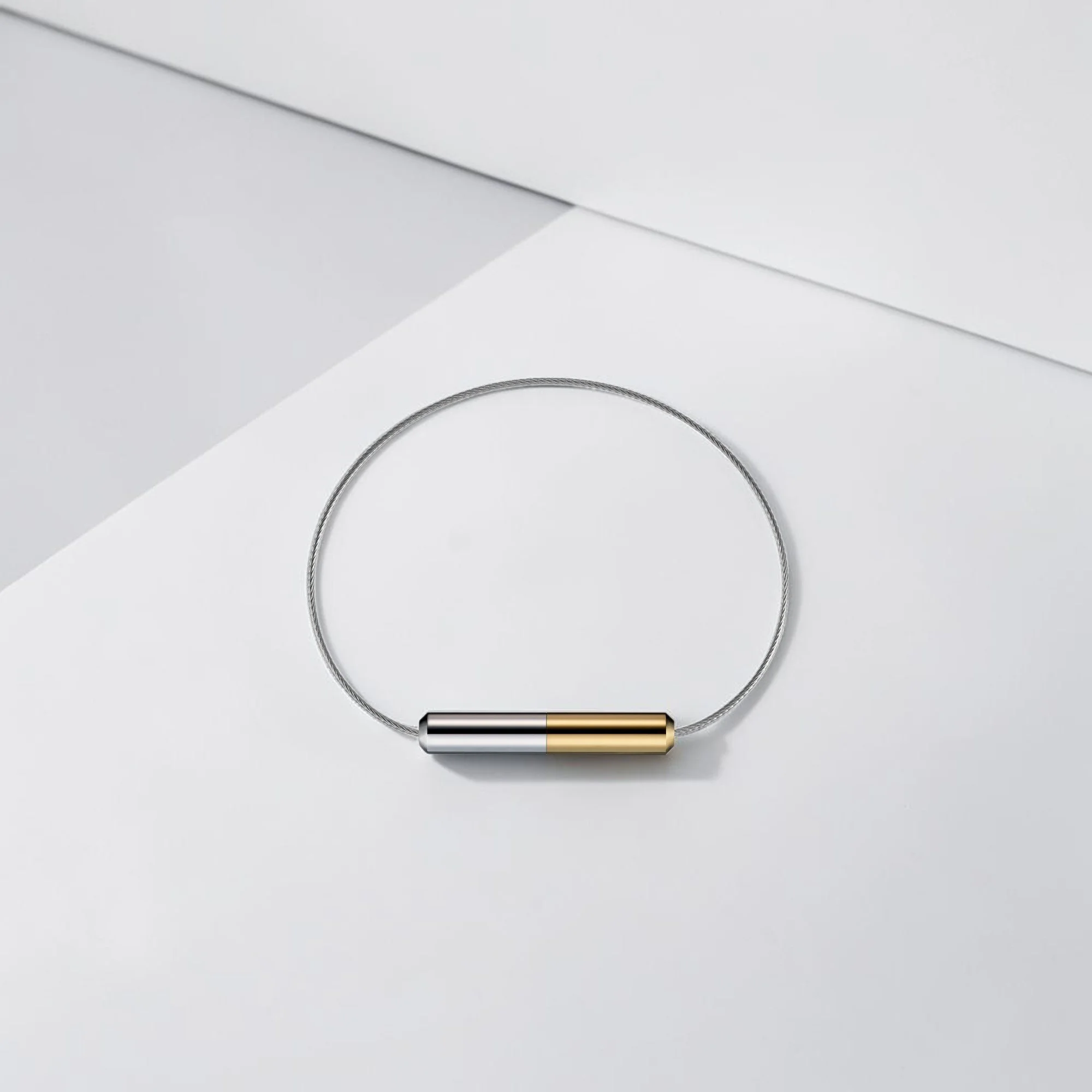 Futurepearl bracelet in yellow gold and rhodium set against a neutral background