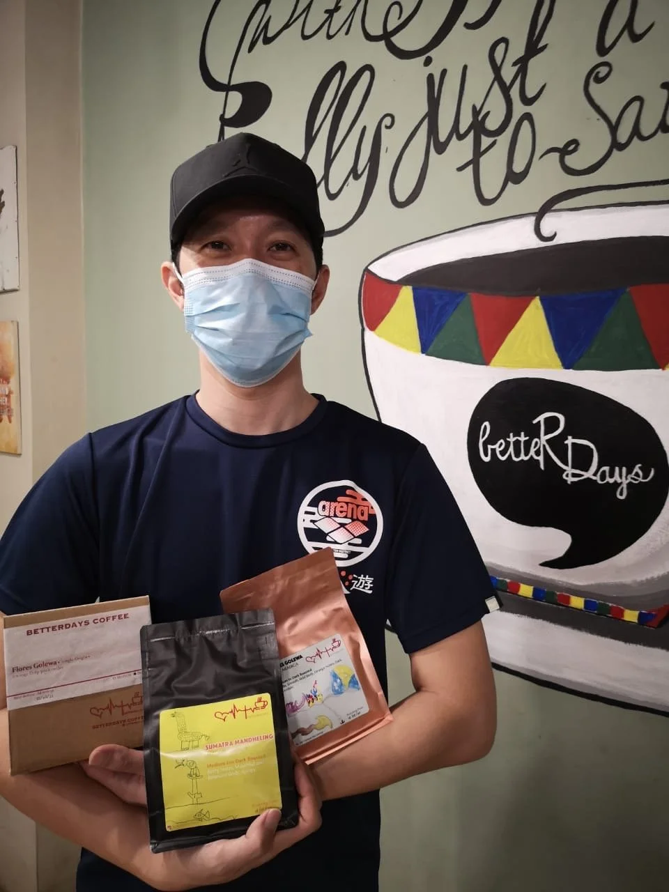 Andrew holding coffee.JPG