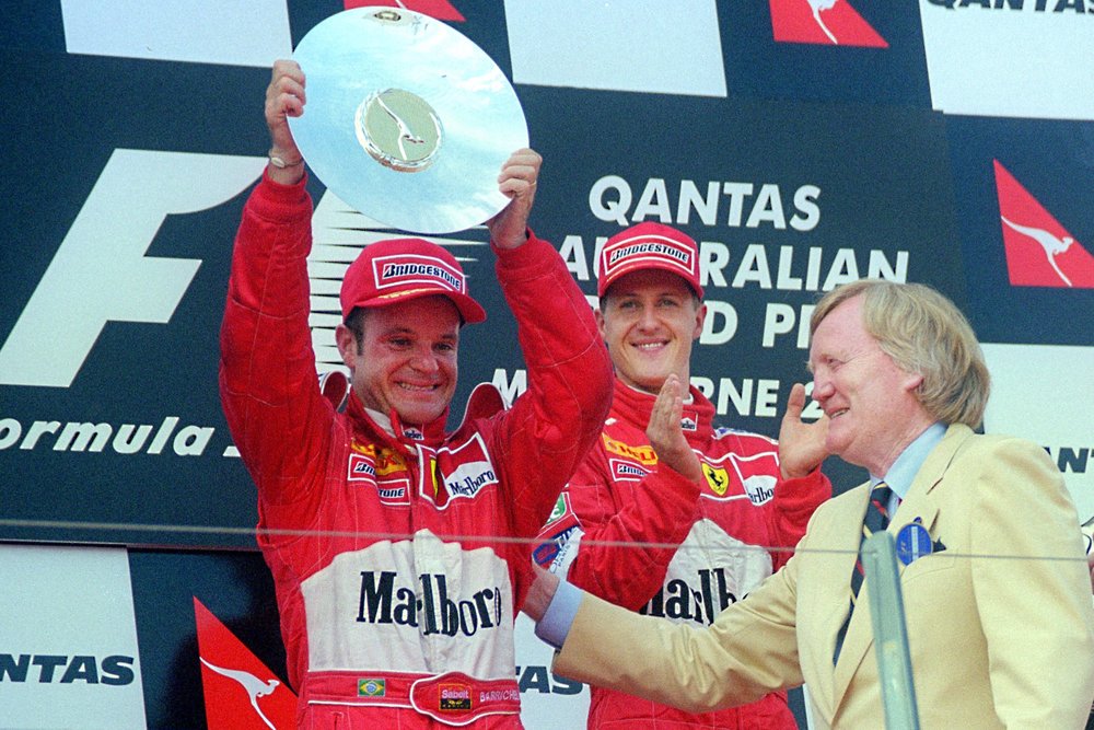 Former Ferrari F1 driver Rubens Barrichello, left, is seen in his F1 glory days