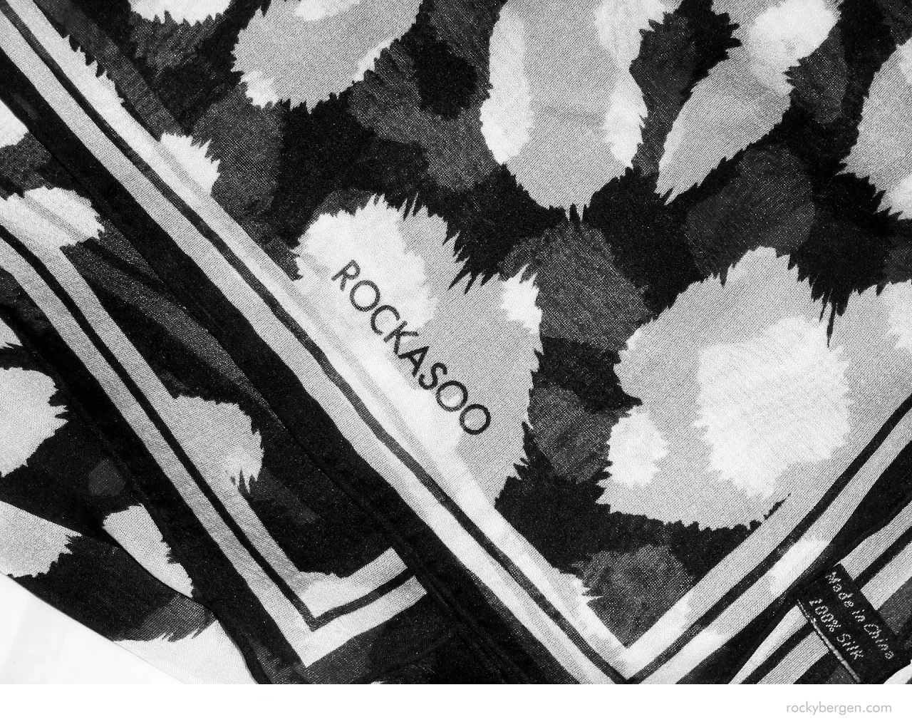  The layers of spots shine through the layers keeping the scarf visually active at all times while worn. 