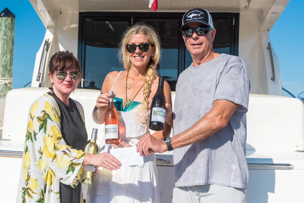 CAA Executive Director, Jennifer Steele with artist Allison Wickey and co-founder of 30A Coastal Dunes Wine Company, George Barnes – celebrating the deployment of underwater sculptures opening in Grayton Beach State Park.