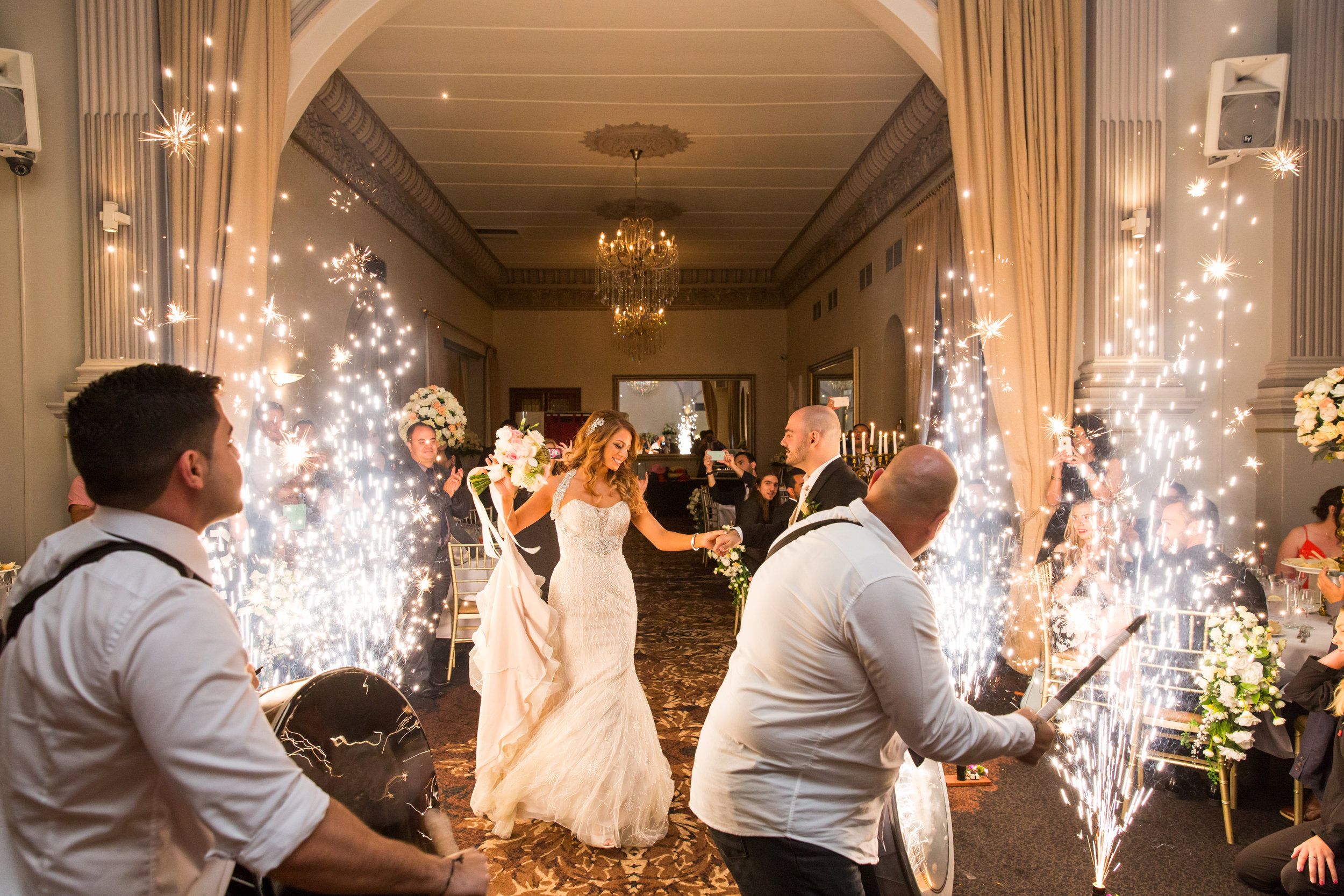 Sparklers lining wedding aisle