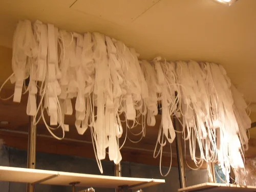   Register tape and plastic wrapping straps was used to create an icicle-inspired store interior.  