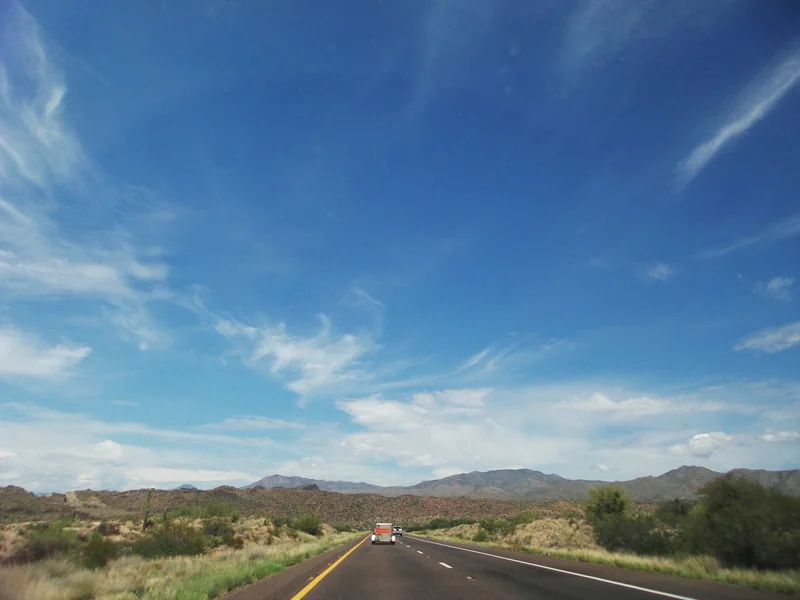 Northeastern Arizona The next morning we drove on through the deserts of Arizona. The topography of this land changes from lowland deserts to large and rolling evergreen covered hills. Leaving California, the sight of greenery came as a welcome change to the yellowing landscape brought on by drought. We continued on through the desert stopping for gas breaks.
