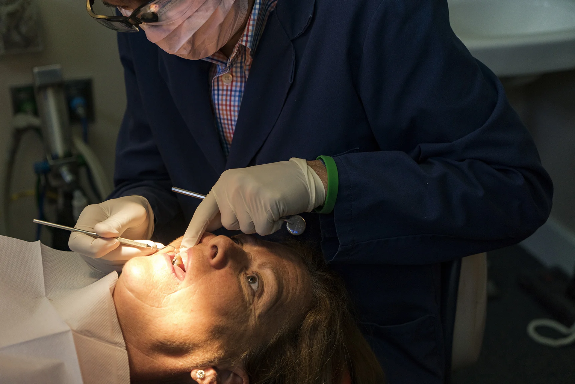 Dr. Johns has made the claim many times that he "has retired from dentistry". Anyone who knows him knows that this is far from the truth. While he may have retired from his own practice, he can still be found performing a procedure or two at his old office. Here he is, doing some repair works on his wife Rose.