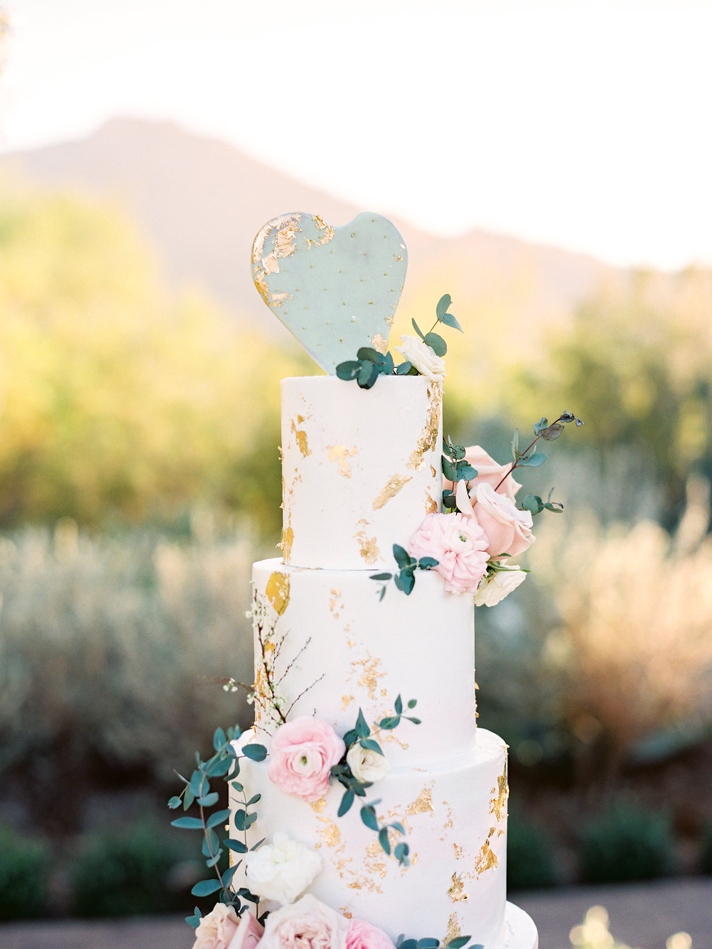 Blush and gold flaked wedding cake.jpg
