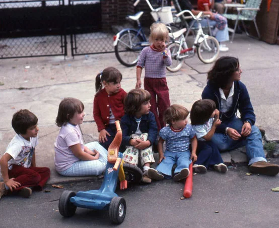 Me and my cousins sitting on our Grandparent’s sidewalk in Brooklyn.