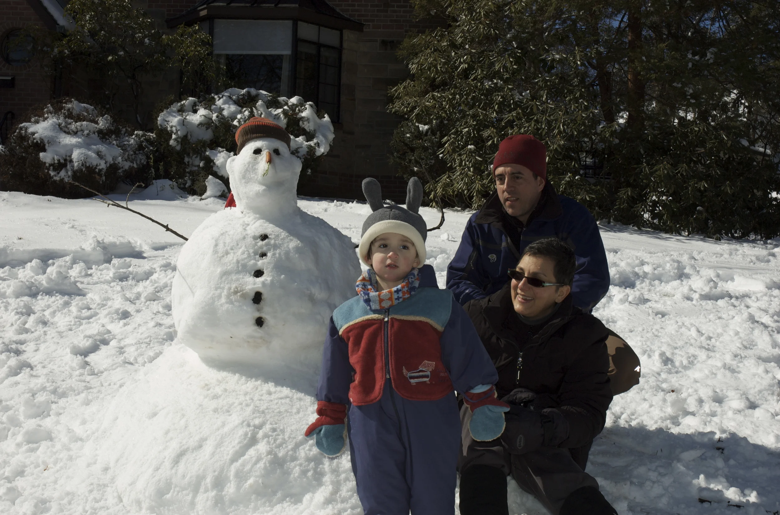 Our godchild, Enzo, Me & JC and our snowman.