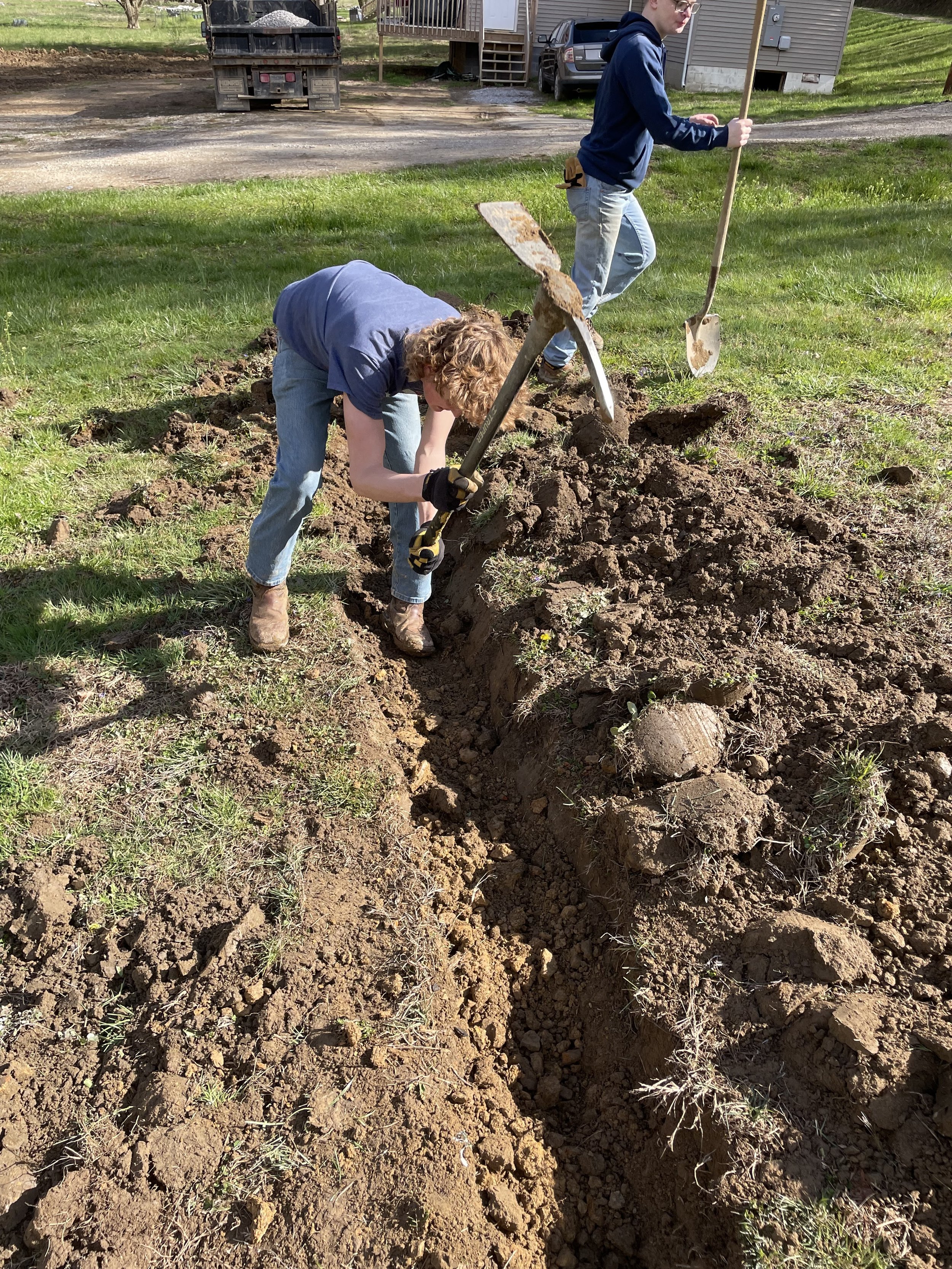 youth-group-digging-trench-pickaxe-camp-nathaniel.jpg