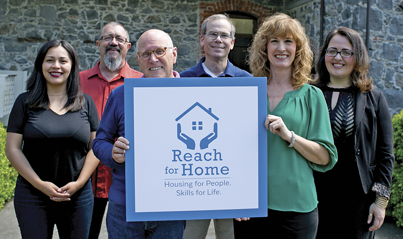 The Reach for Home team with the new logo.