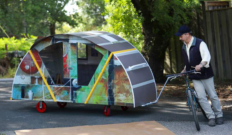 Sebastopol architect Ken Berman designed a mobile shelter he calls "The Turtle" that can be towed by a bike. The shelter includes LED lighting, storage and an iPad mounting system. (John Burgess/The Press Democrat)