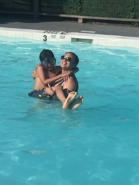 My mom carrying me because my daddy wanted to dunk me in the water.