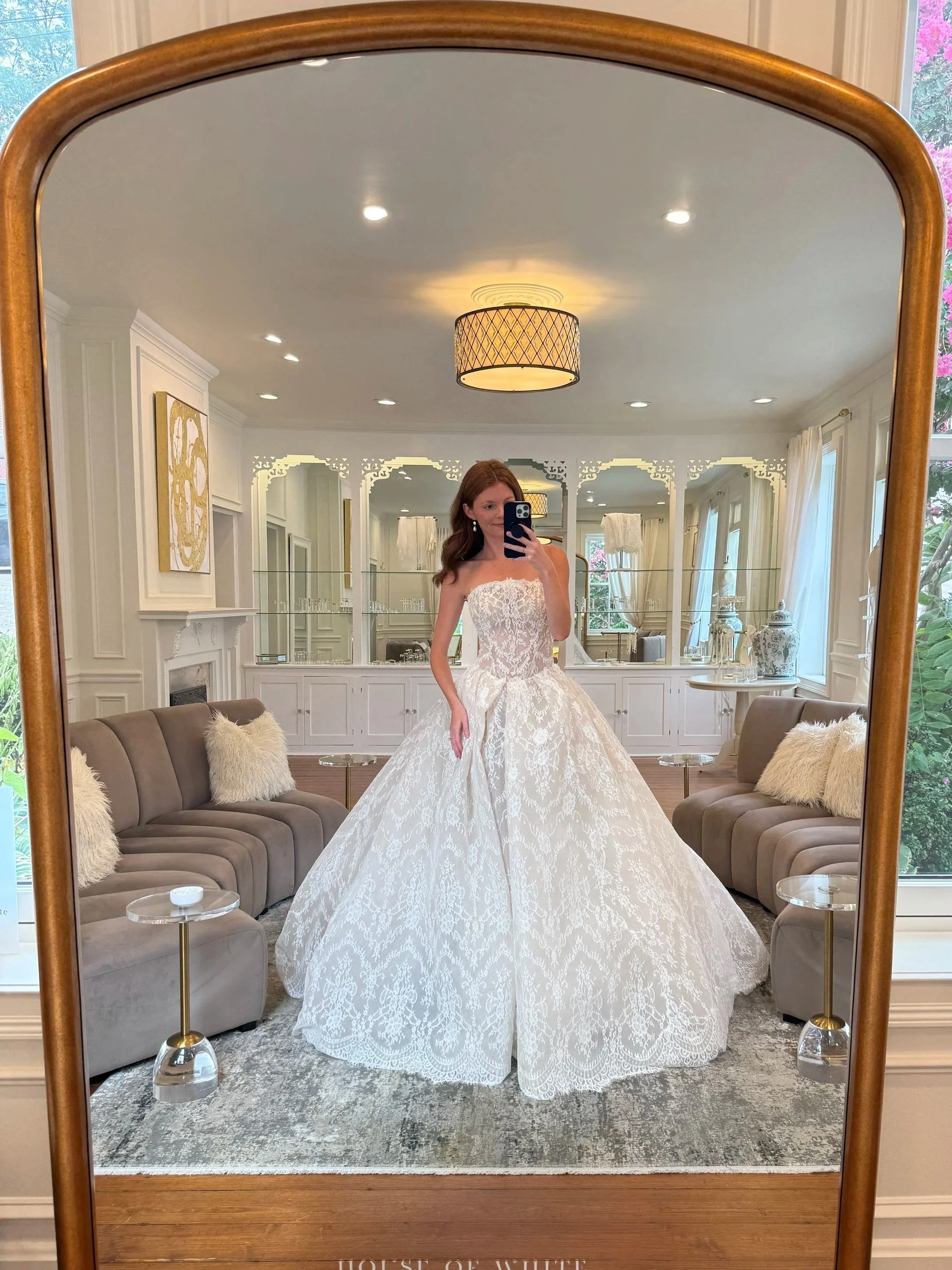 A model wears a dramatic strapless antique lace ballgown at House of White Bridal Boutique in Newburgh, Indiana