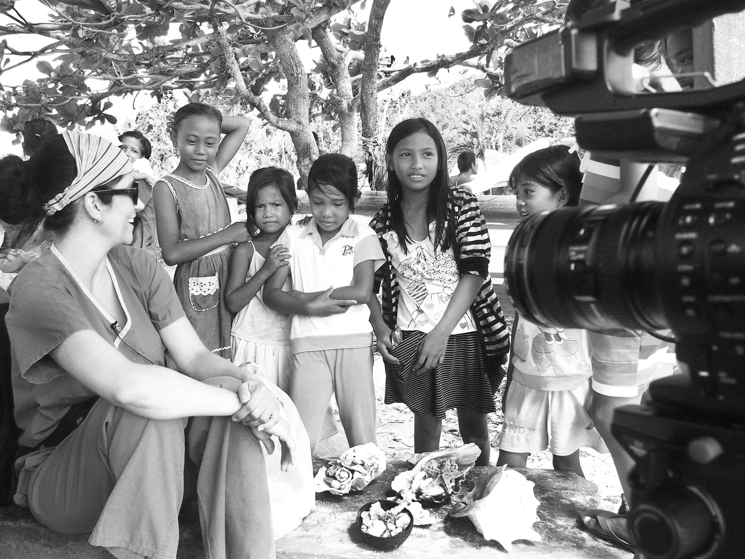  Erin L. FitzGerald behind the camera on Olotayan Island in the Philippines, documenting nurses providing aid in the aftermath of Typhoon Haiyan/Yolanda. Photo by Erin L. FitzGerald. 