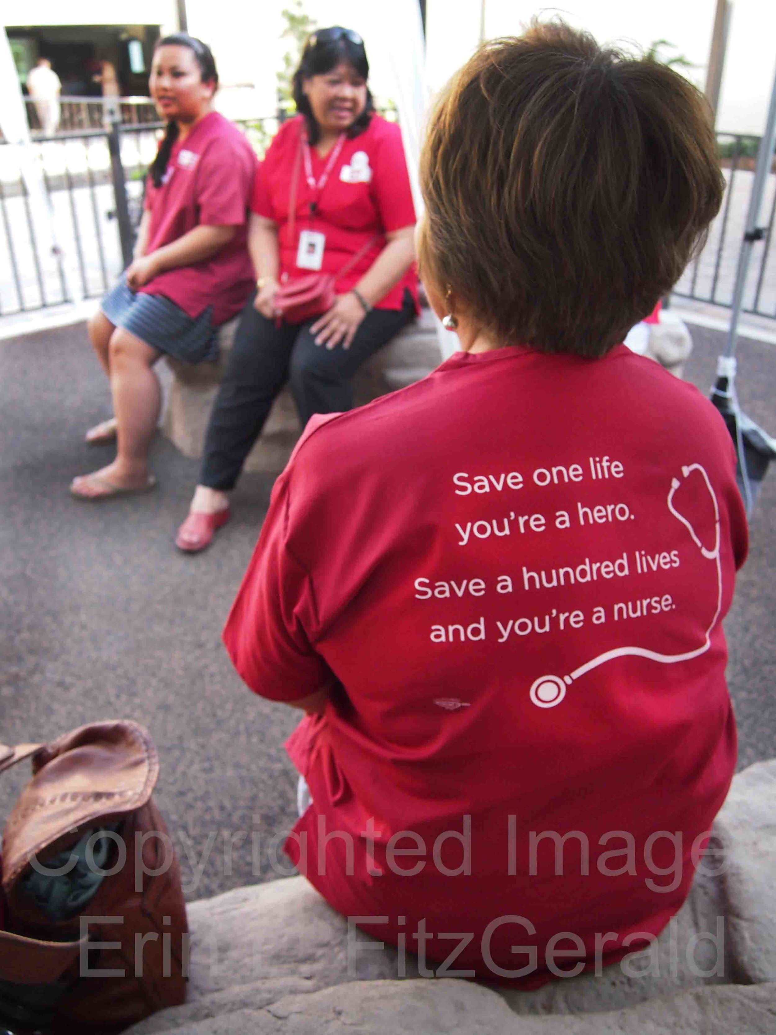   Nurses on the Medicare-for-All statewide bus tour take a break after caring for patients at a health screening in San Luis Obispo, California.  