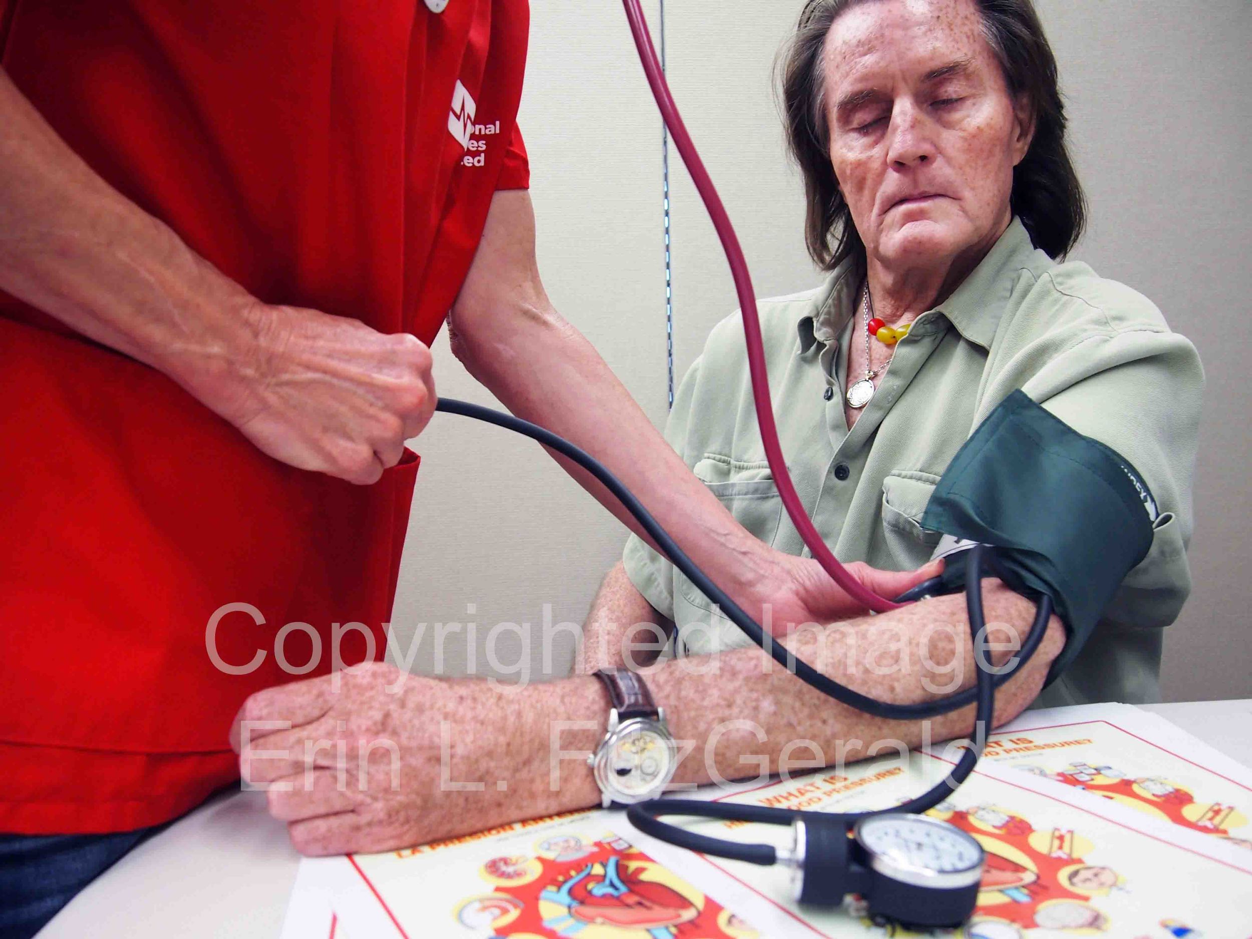  A man receives a blood pressure check from a nurse in San Luis Obispo, California. Nurses traveled the state to provide screenings and town hall meetings about access to care. 