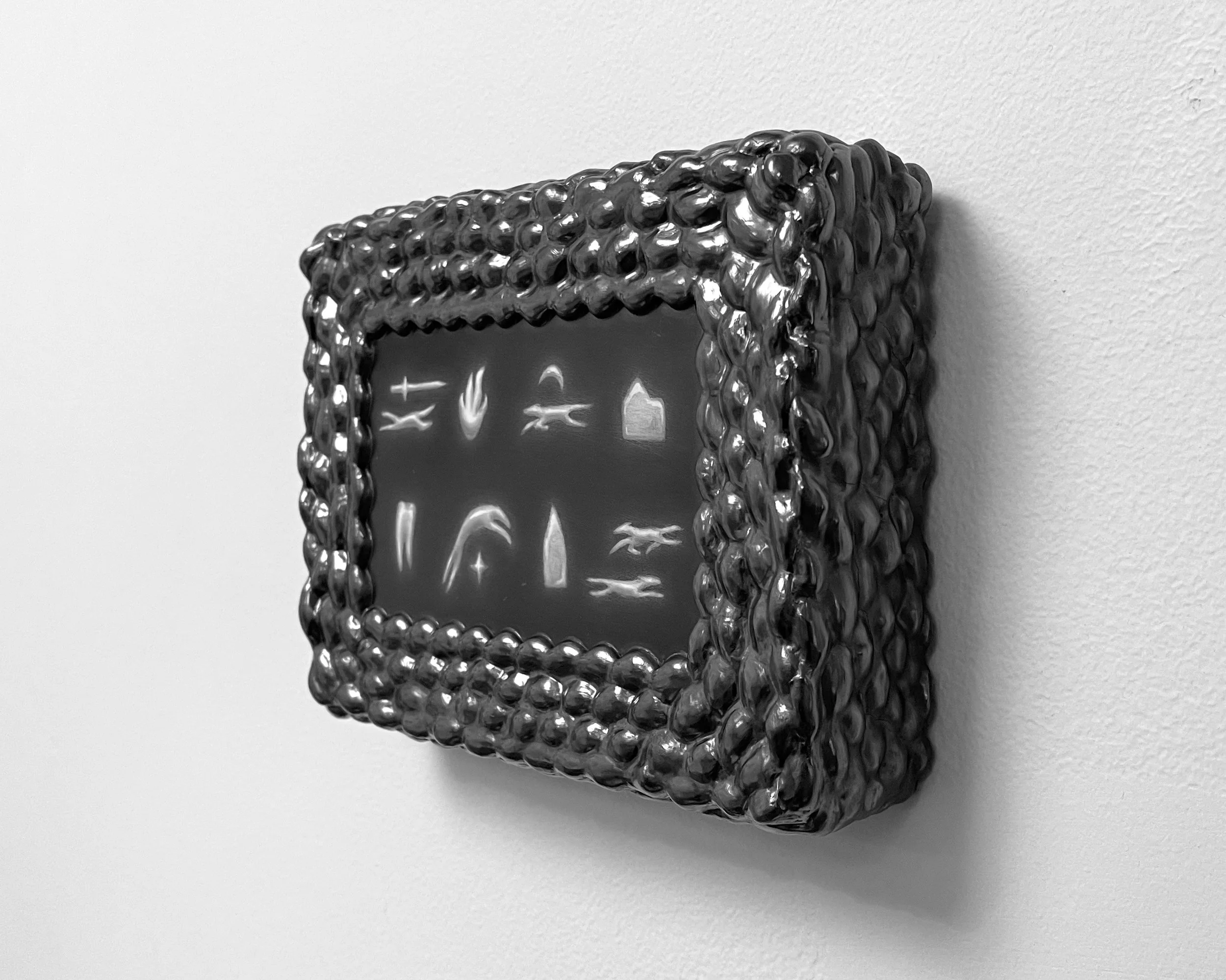   an attempt at order -  view 2    graphite on panel with graphite frame. 5.5×7.5×1.75. 2025 